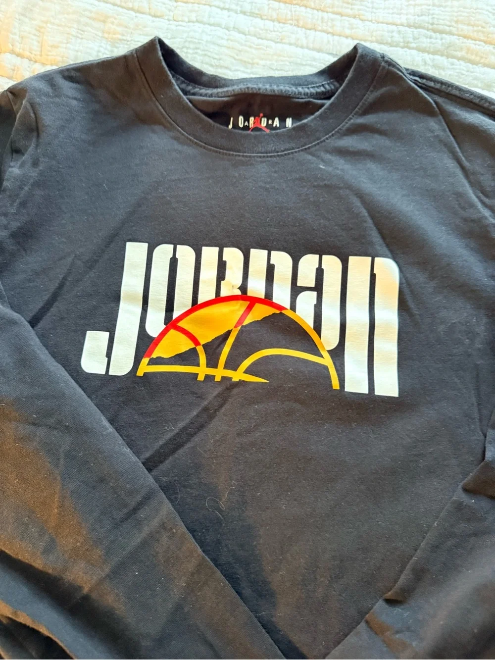 Jordan Black Long Sleeve Tee with White Logo and Orange Basketball Accent
